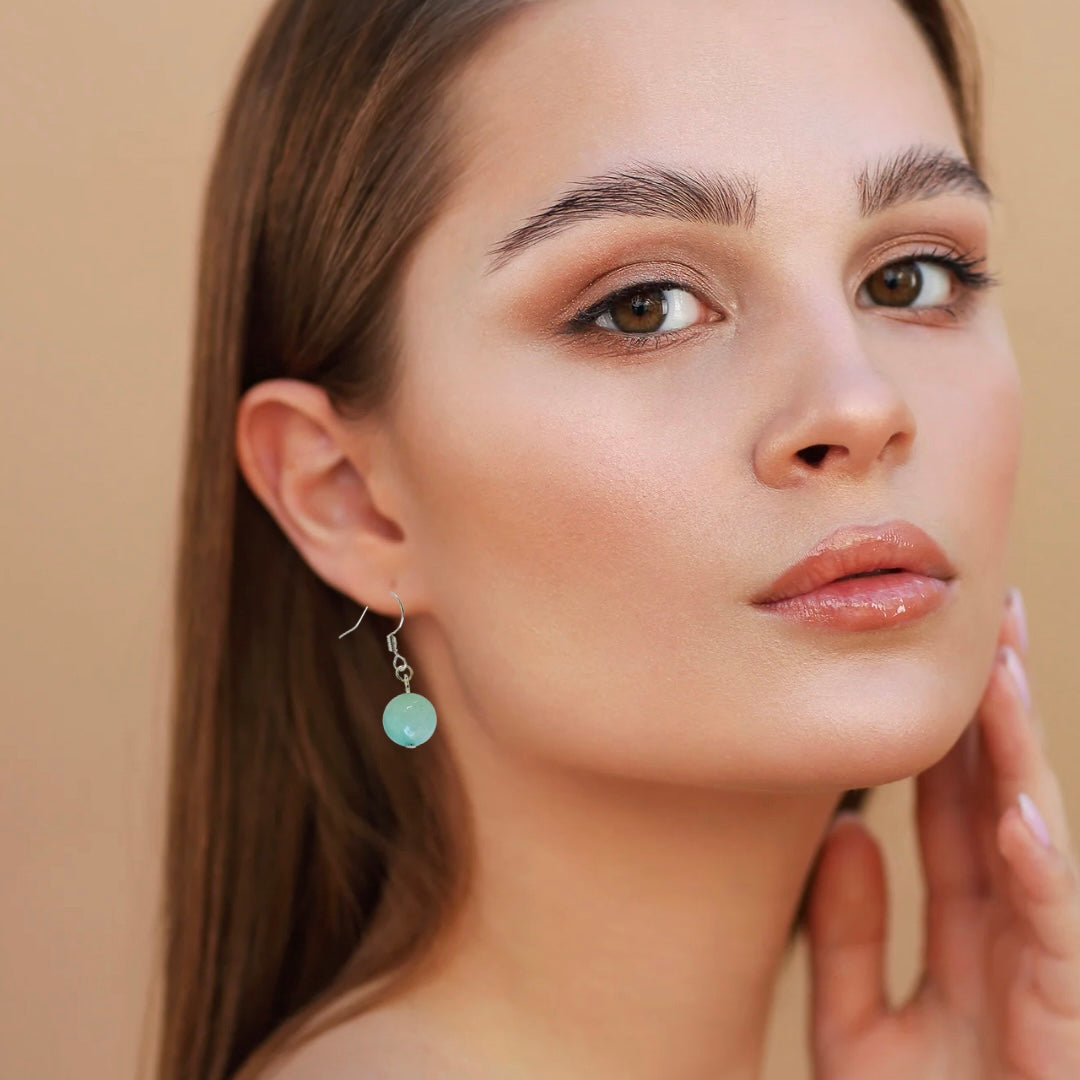Adorned Natural Stone Dangle Ball Earrings With Silver Finish
